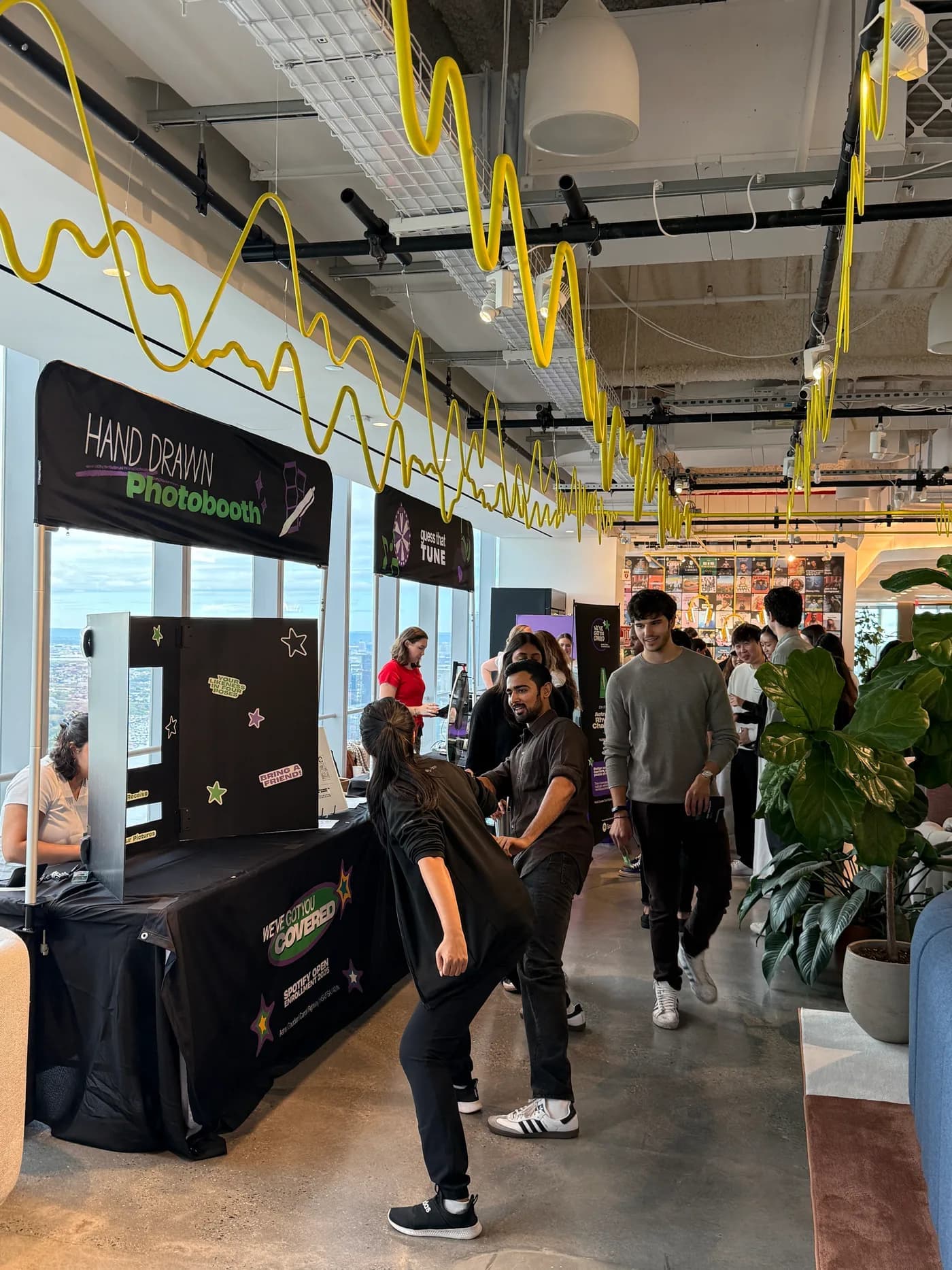 Guests exploring the Spotify and Aetna event's activity stations